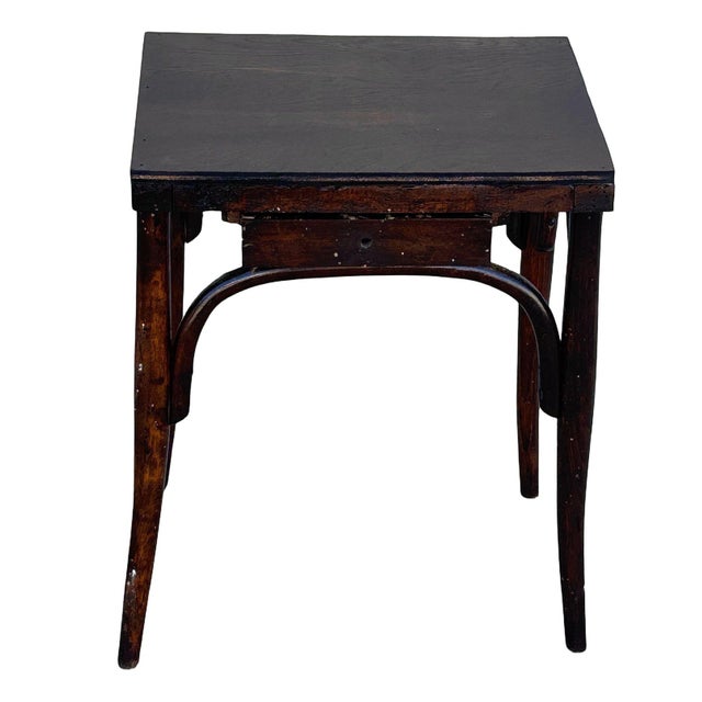 Rare late Victorian polished oak scrolling occasional table by Thonet features a distinctive four-lobed leg design crafted...
