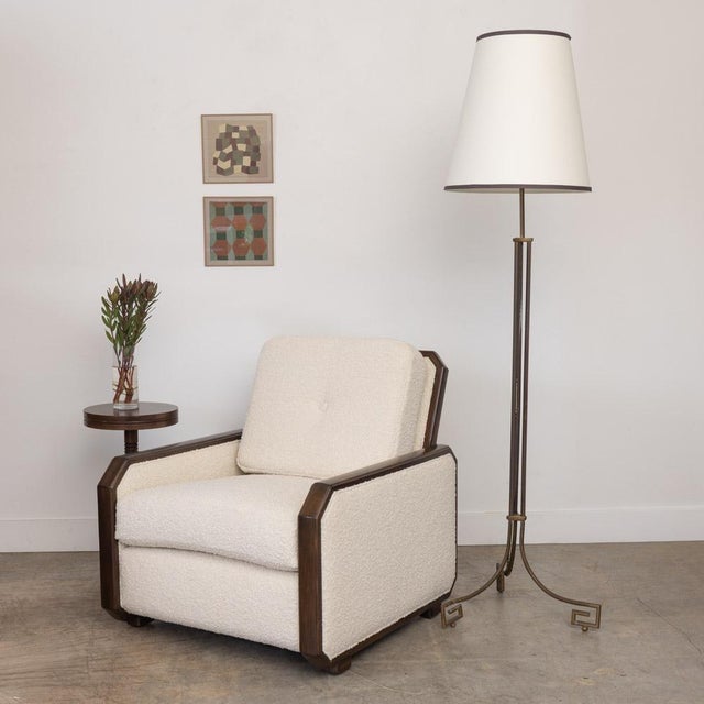 Stunning vintage Art Deco club chair from France. Beautiful sculptural wood frame with angled detail. Newly upholstered in...