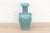 A stunning vessel of quiet power, in a color from the depths of the sea. This porcelain vase is a masterpiece of artistry,...