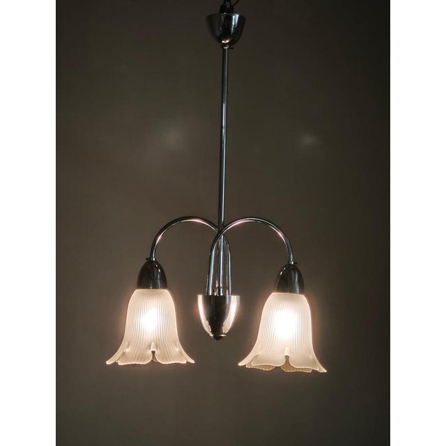 Elegant mid-century modern chandelier manufactured by elektroinstala děčín in czechoslovakia during the 1950s. The design...