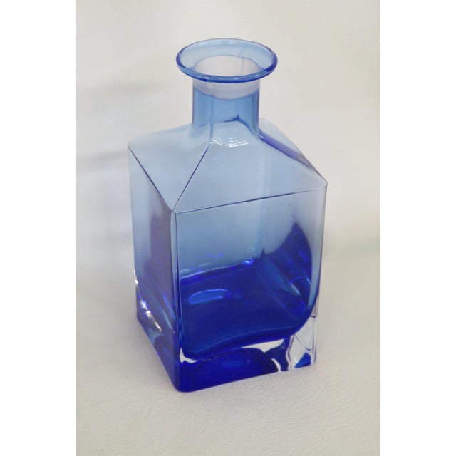 This gorgeous vase / bottle is made of glass. This piece has lovely vintage style, it features a beautiful cobalt blue...