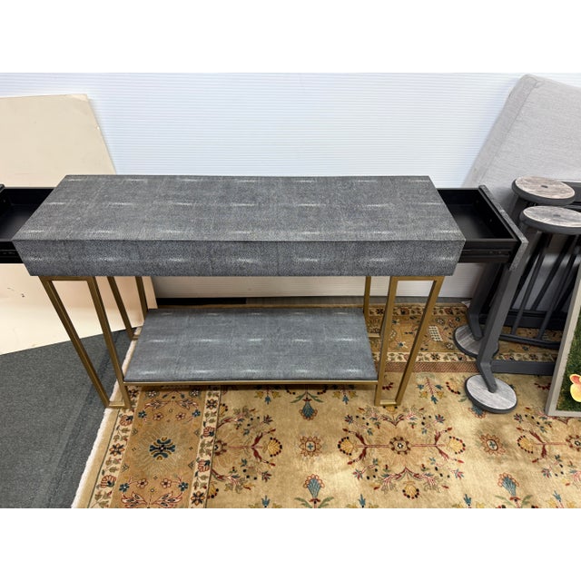 Design Plus Gallery presents a Faux Shagreen Console Table from Currey & Co. The luxurious console will delight ou with...