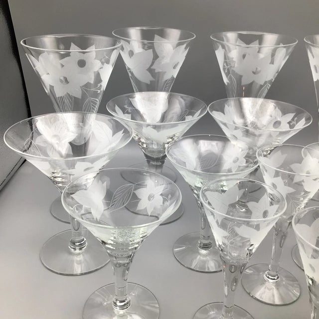 Great set of 18 floral and leaf etched cocktail glasses by an unknown manufacturer. 5 Wine/Water, 5 Martini, 4 Champagne...