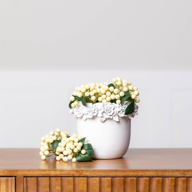 Add graceful botanical charm to your decor with this Decorative Floral Container. The vase features a softly rounded...