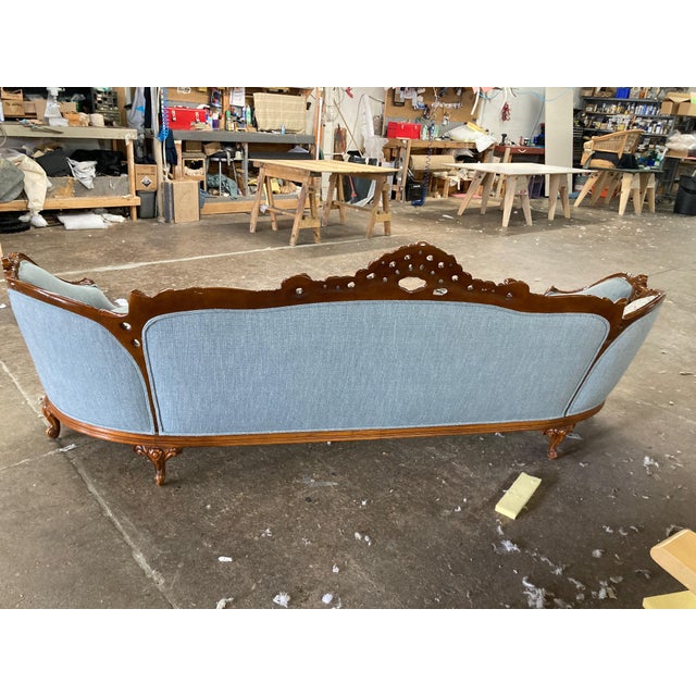 Newly reupholstered with foam/down seat cushions. Looks brand new.