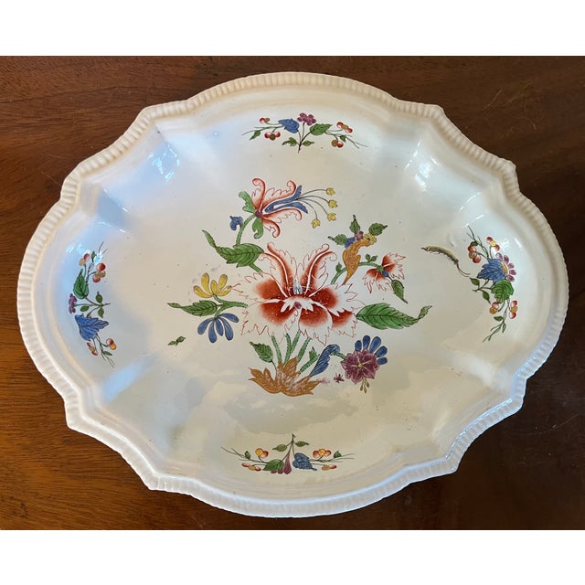 Antique 18th century Italian Tulipano Doccia porcelain oval bowl with shaped rim. Measures 9 3/4" x 7 7/8" x 1 1/4" deep....