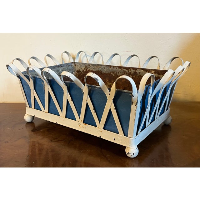 1930's white painted zinc X-form basketweave cachepot planter or jardiniere with blue tole liner on ball feet. Measures 12...