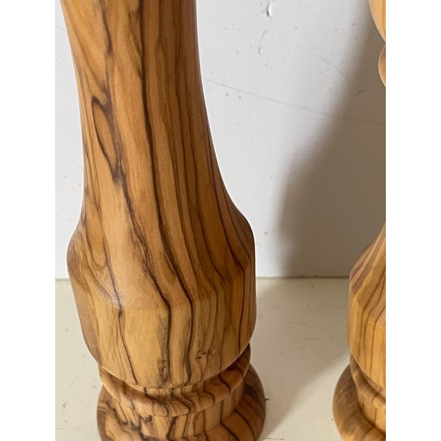 Williams Sonoma Olive wood tall salt and pepper shakers .