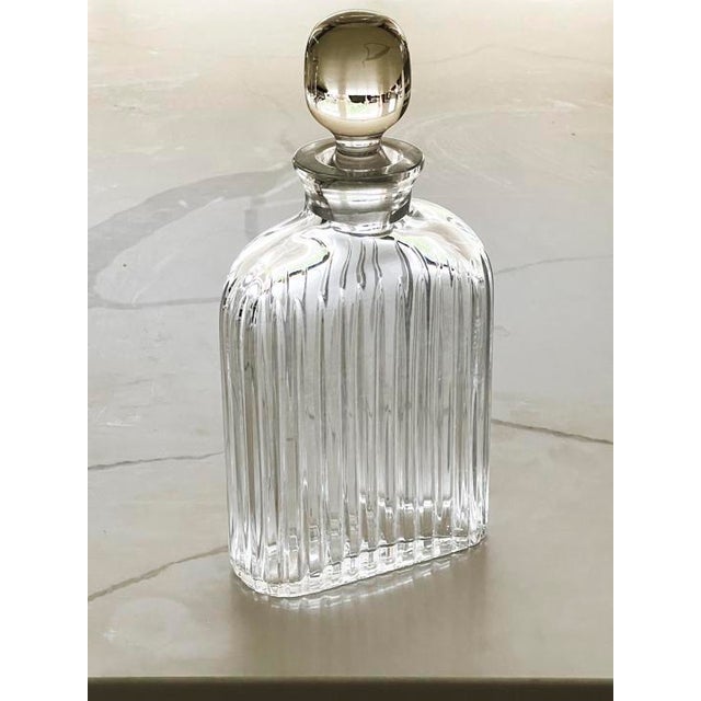 An Elegant Crystal Decanter - The way the light plays though is gorgeous This is a heavy weight, solid piece, it feels...