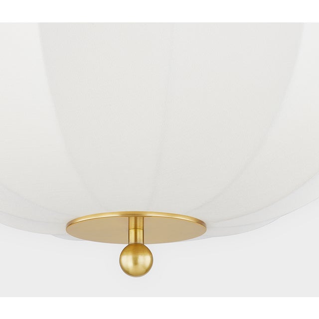 Inspired by mid-century Danish design, Meshelle features a whimsical umbrella shape. Light flows both through the shade...