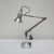 Three-spring chromed and polished metal anglepoise desk lamp by herbert terry & sons. Three step base and perforated lamp...