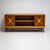Pair of elegant Italian sideboards, featuring sliding doors and decorative X-shaped raised décors in light wood. Each...