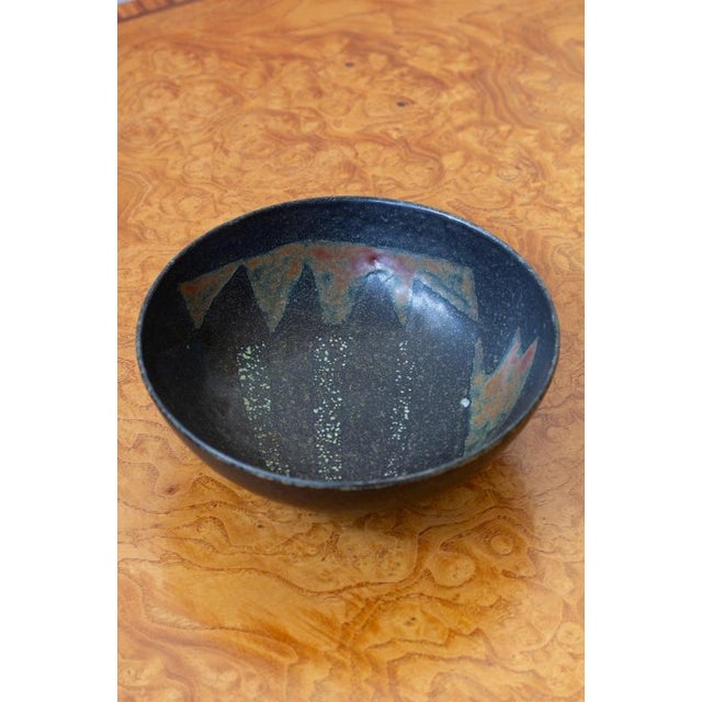 Unique stoneware bowl by Carl-Harry Stålhane. Hand made at Rörstrand, Sweden in 1953. Glazed stoneware with a black base...