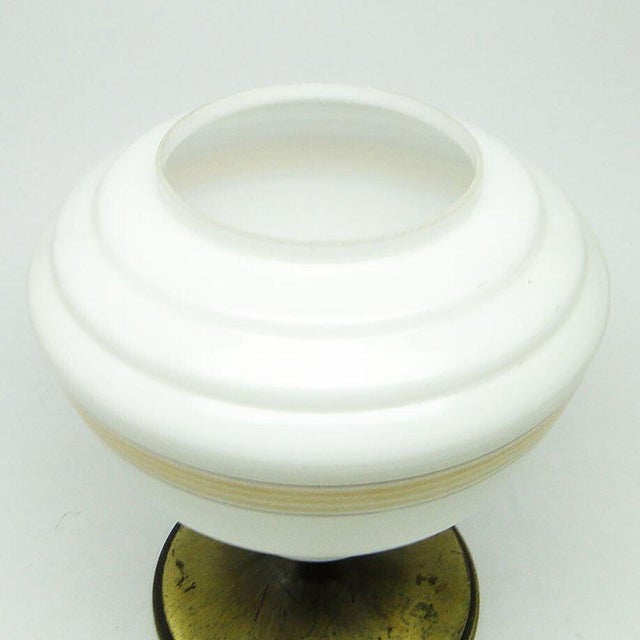 The pendant lamp was produced in the 70s. The construction is brass, glass lampshade. It is preserved in very good...