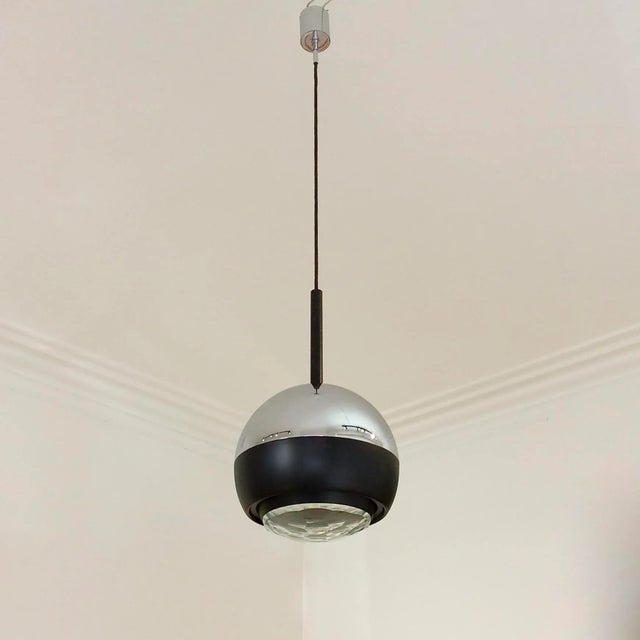 Stilnovo pendant lamp mod. 1230, circa 1960, Italy. Faceted polished glass, black enameled metal, chromed steel. One bulb...