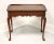 A tea table in the Queen Anne style by Statton Furniture. Solid cherry with their Centennial finish, two side slide out...