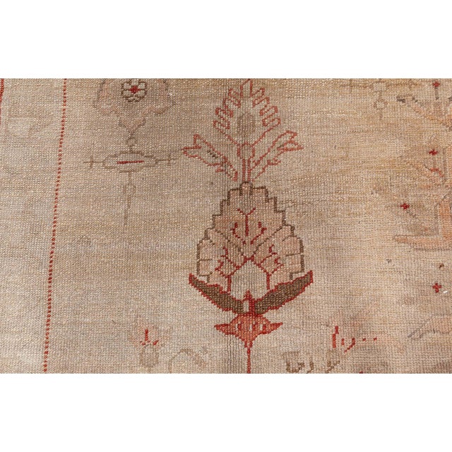 This graceful antique Turkish Oushak rug captures the poetic spirit of Anatolian craftsmanship with its delicate...