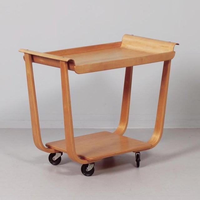 Rolo pb01 serving trolley designed by cees braakman for pastoe in 1950. A light and functional design in bent birch wood,...