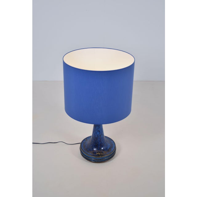 Danish table lamp designed by Frank Tromborg in the 1960s. This was manufactured in collaboration with Axella Stentøj,...