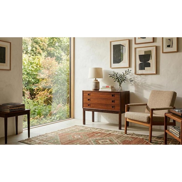 Produced in Denmark in the 1960s, this elegant mid-century chest of drawers is crafted in beautifully grained rosewood....