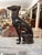 A striking blend of elegance and symbolism, this 21-inch cast metal dog statue captures the refined silhouette of a...