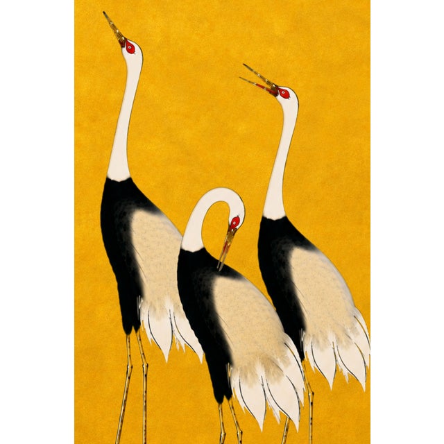 A striking crane artwork featuring three elegant cranes set against a rich golden backdrop. Inspired by traditional...