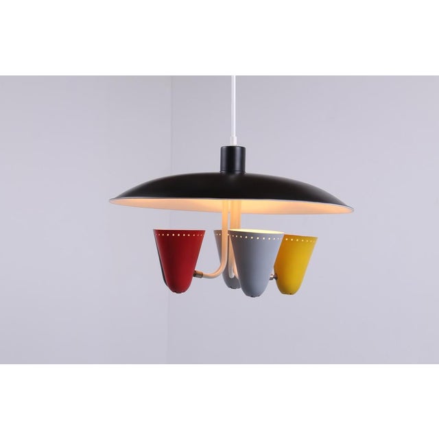 The original fifties hala pendant 'saucer' lamp designed by h. Busquet. Well documented in several catalogues from the...