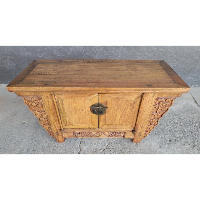 A Chinese alter cabinet in the Qing Dynasty style. 20th Century. 39.5 inches wide. 21 inches high. 16.5 inches deep.