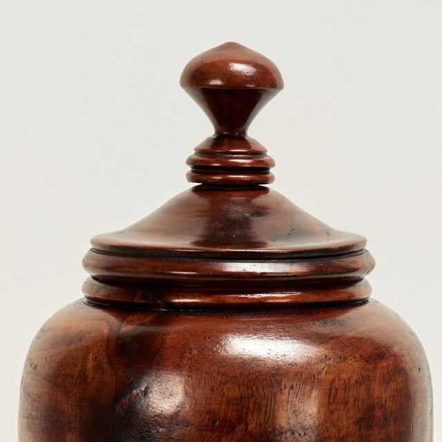 Handsome vintage lidded urn handcrafted in turned mahogany in a timeless classical form.