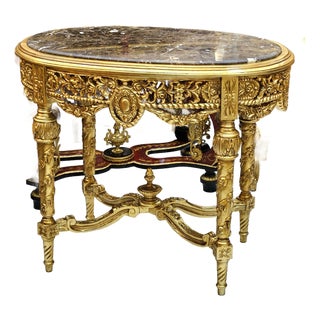 French Louis XVI Style Gold Leaf Coffee Table With Marble Top & Ornate Carved Details For Sale