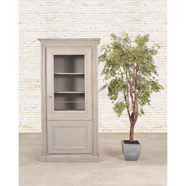 A rustic 19th Century French Country farmhouse style painted pine hutch cabinet or cupboard with a beautifully weathered...