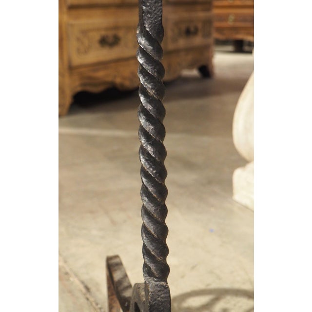 An amazingly detailed pair of wrought iron chenets, these early cooking implements would have been found in the fireplace...