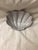 This beautiful vintage shell – shaped dish features a subtle gray – white glaze. This piece has gentle ribbing and a...