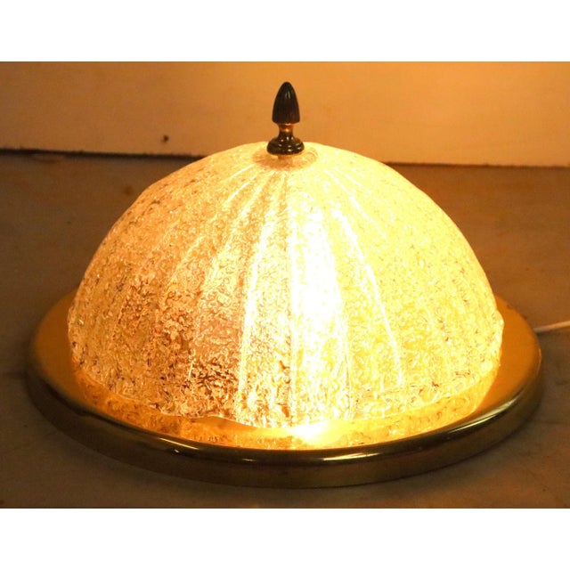 Beautiful, somewhat classically designed ceiling lamp with brass-colored fixture and heavy "ice" glass. Thanks to its...