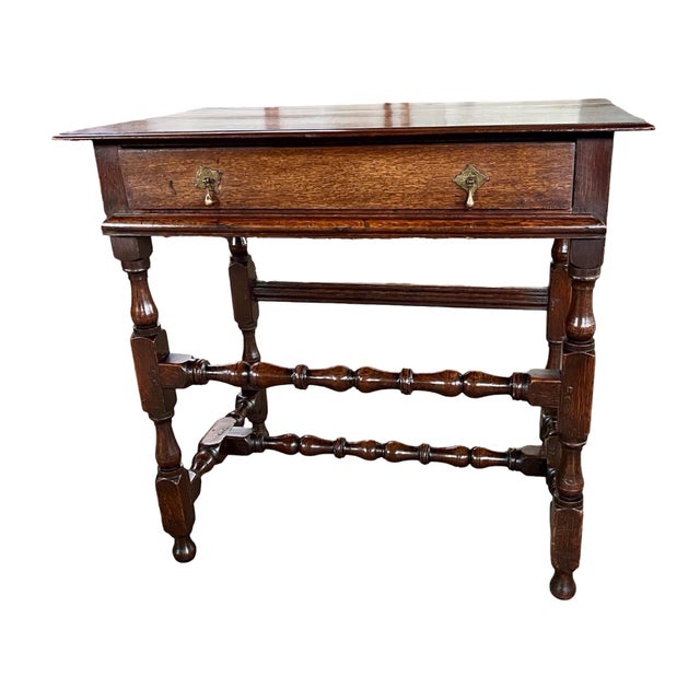 Side table handmade in England in the early 1700s using oak and peg construction. The table is a beautiful example of...