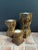 Trio of wood candleholders with a twisted design & marbled pattern resembling tortoise shell. We don’t know anything about...