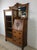 This antique oak side by side features three dovetailed drawers with brass hardware, compact drop front writing surface,...
