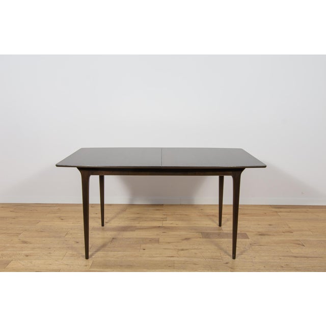 This extendable teak dining table was manufactured by the Scottish furniture maker A.H. McIntosh & Co. in the 1960s. The...