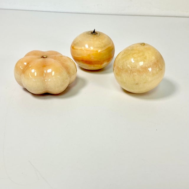 Vintage Home is pleased to present this set of 3 hand-carved Italian Alabaster Marble Fruit. There is an orange, apple and...