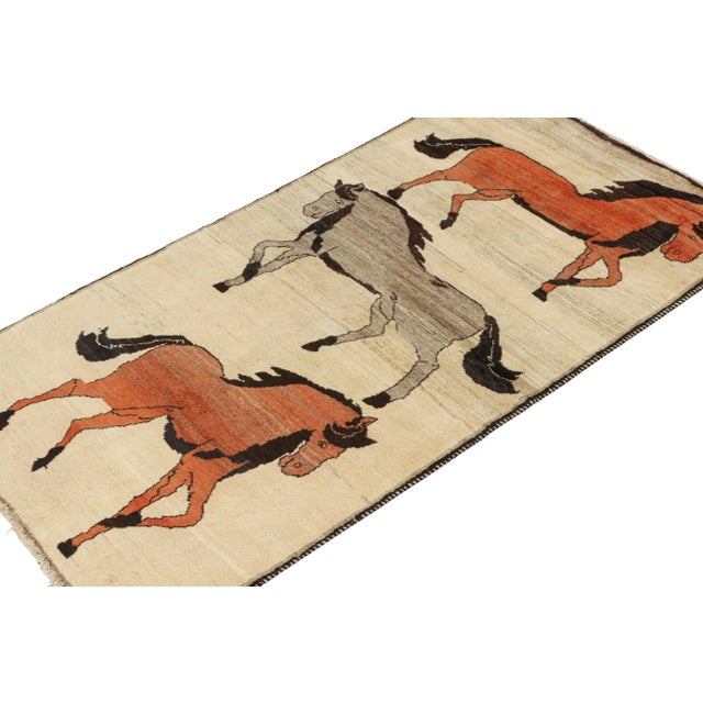 This vintage 4x7 Persian rug is a rare tribal piece, hand-knotted in wool circa 1950-1960. The design favors a beige field...