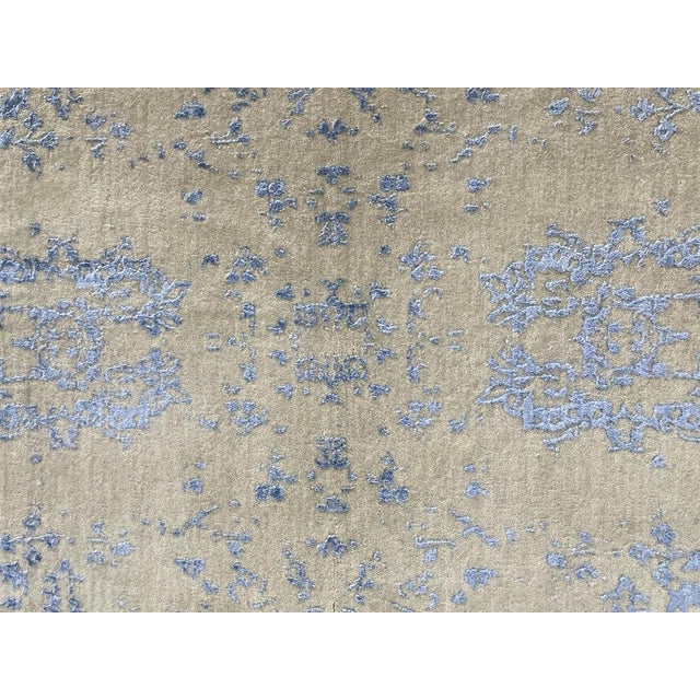 Hand knotted of top quality wool and viscose This unique and innovative design rug is an eye catching example that...