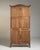 A striking Louis XIV style vitrine showcasing bold structure and classical proportions. The design emphasizes symmetry and...