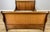 A striking Vintage French double bed with an elegant sleigh-style profile, featuring gracefully curved ends, substantial...