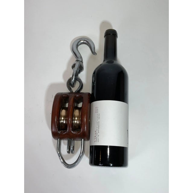 Double sheave pulley block with polished steel hook. Pulley block has solid brass polished wheels and brass pin...