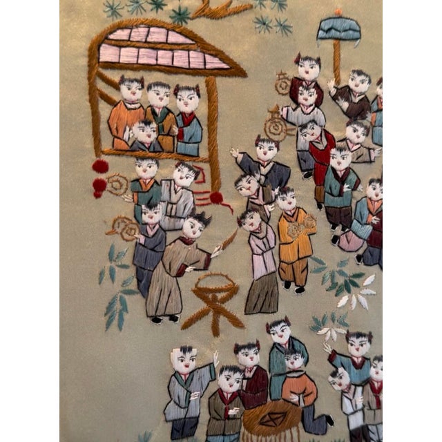 An exceptionally charming and finely detailed mid-century Chinese hand-embroidered silk panel illustrating the coveted...