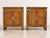 Elevate your bedroom or living space with this striking pair of vintage Campaign-style nightstands by Century Furniture....