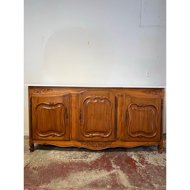 Vintage Country French walnut marble top buffet is a classic example of understated elegance! Crafted from beautifully...