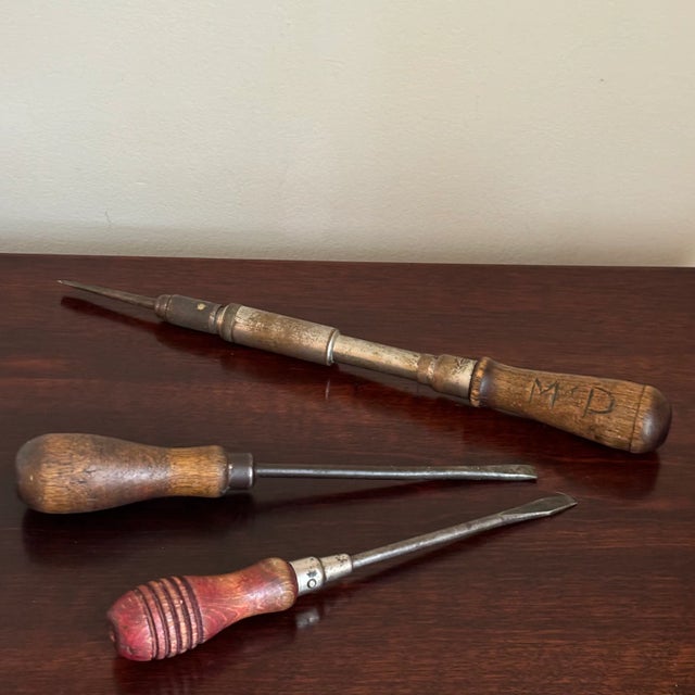 A fun set of vintage wood-handled screwdrivers from the early- to mid-20th century. One has a previous owner's initials...