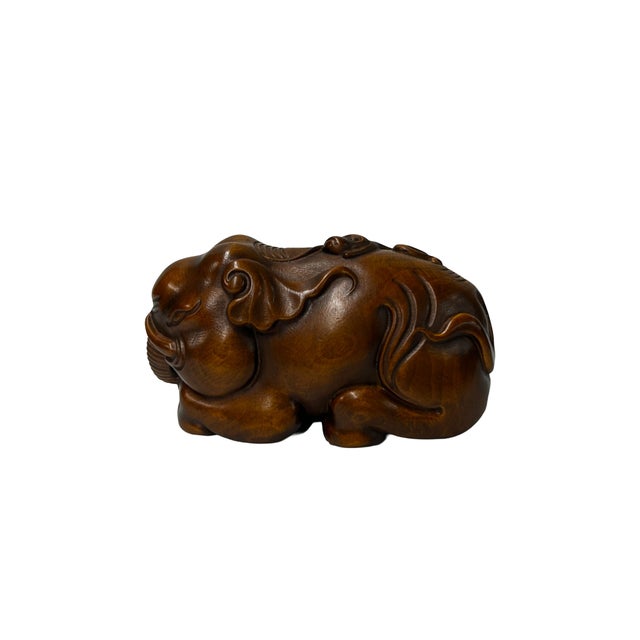 Elevate your collection with this exquisite, hand-carved wooden elephant figurine, measuring 3 inches in length....