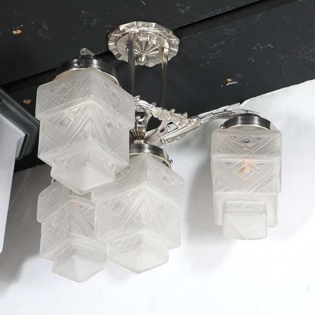 This striking Art Deco Skyscraper-Style Nickeled Bronze &amp; Frosted Glass 4-Arm Chandelier originates in the United...